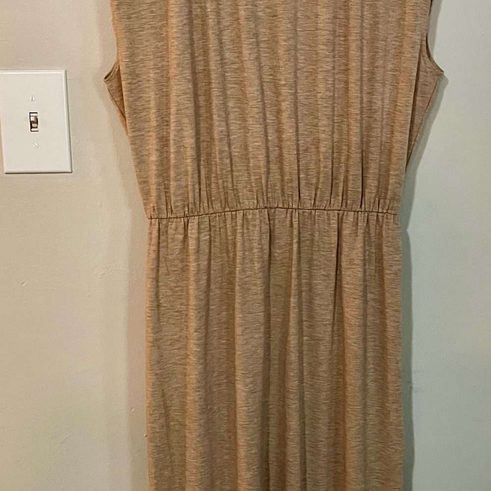 Camel colored fitted at the waist no sleeve ankle length dress.